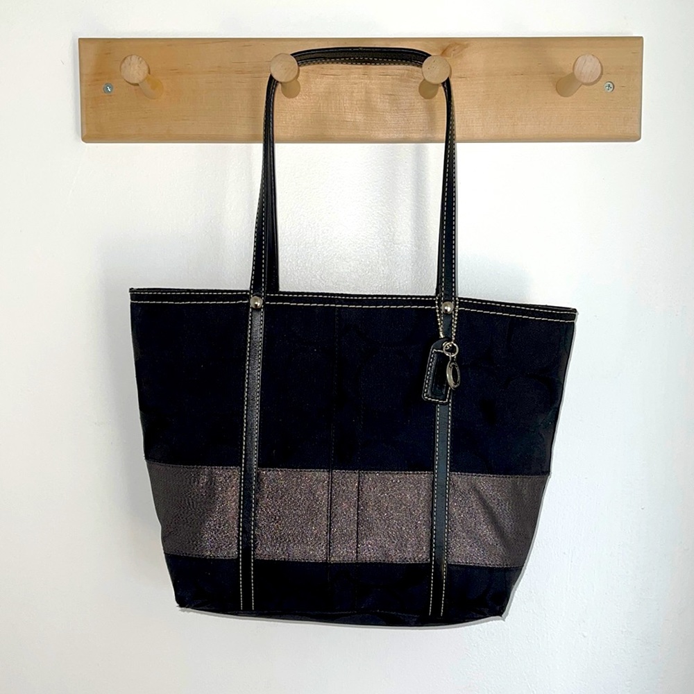 Coach monogrammed black medium size purse. Excellent pre owned condition.